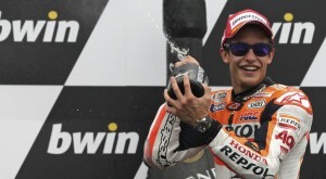 Honda MotoGP rider Marquez of Spain splashes with champagne as he celebrates after winning in the class race during the Czech Grand Prix in Brno